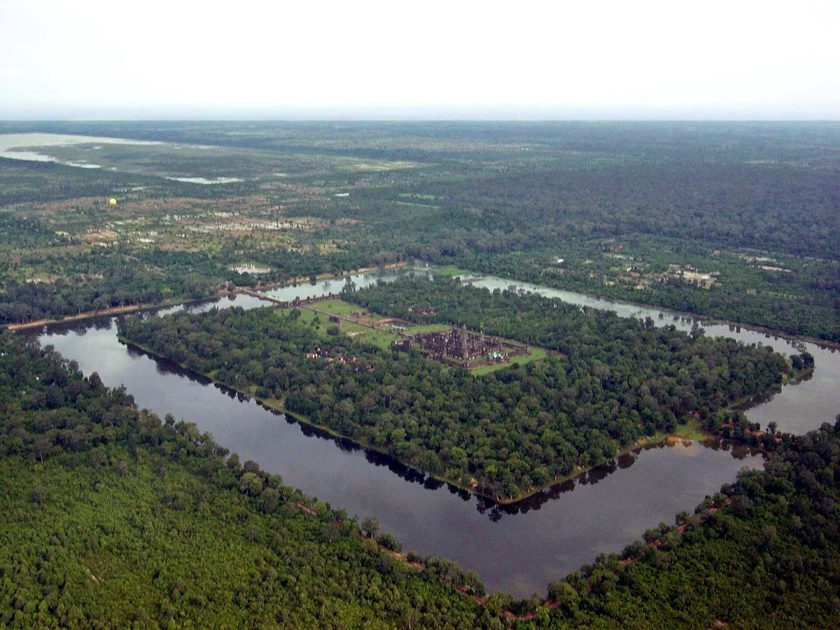 Angkor Wat and its moat surrounded by forest, seen from the air, seen on Angkor Wat tours from Siem Reap