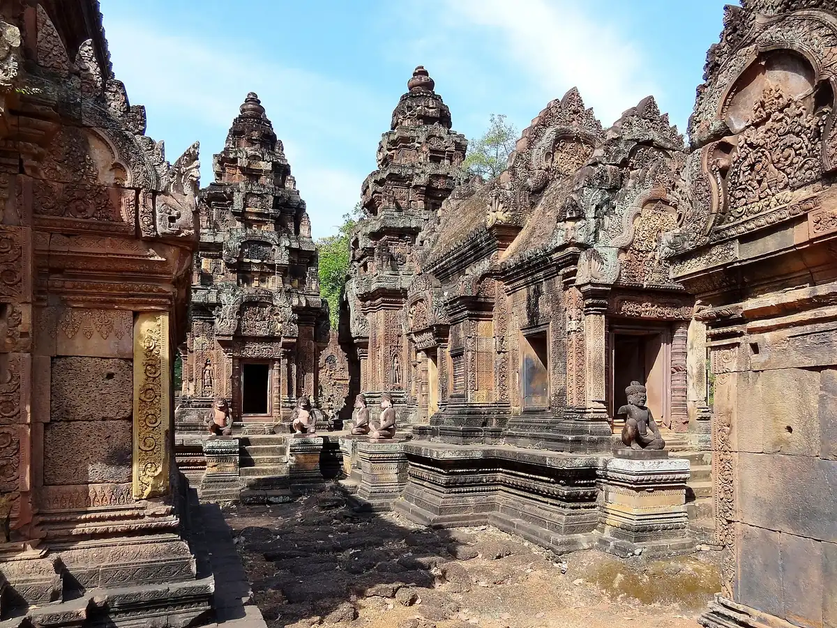 The central and southern towers of Banteay Srei in red sandstone, seen on Angkor Wat tours from Siem Reap