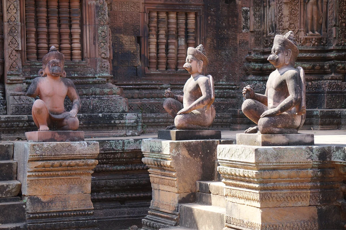 Guardian figures flanking the steps of the Banteay Srei sanctuary and mandapa, seen on Angkor Wat tours from Siem Reap