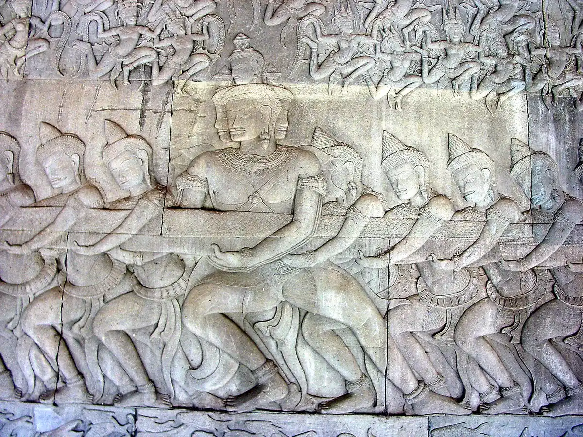 A deva from the Churning of the Sea of Milk bas-relief in the Angkor Wat galleries, explained by guides on Angkor Wat tours