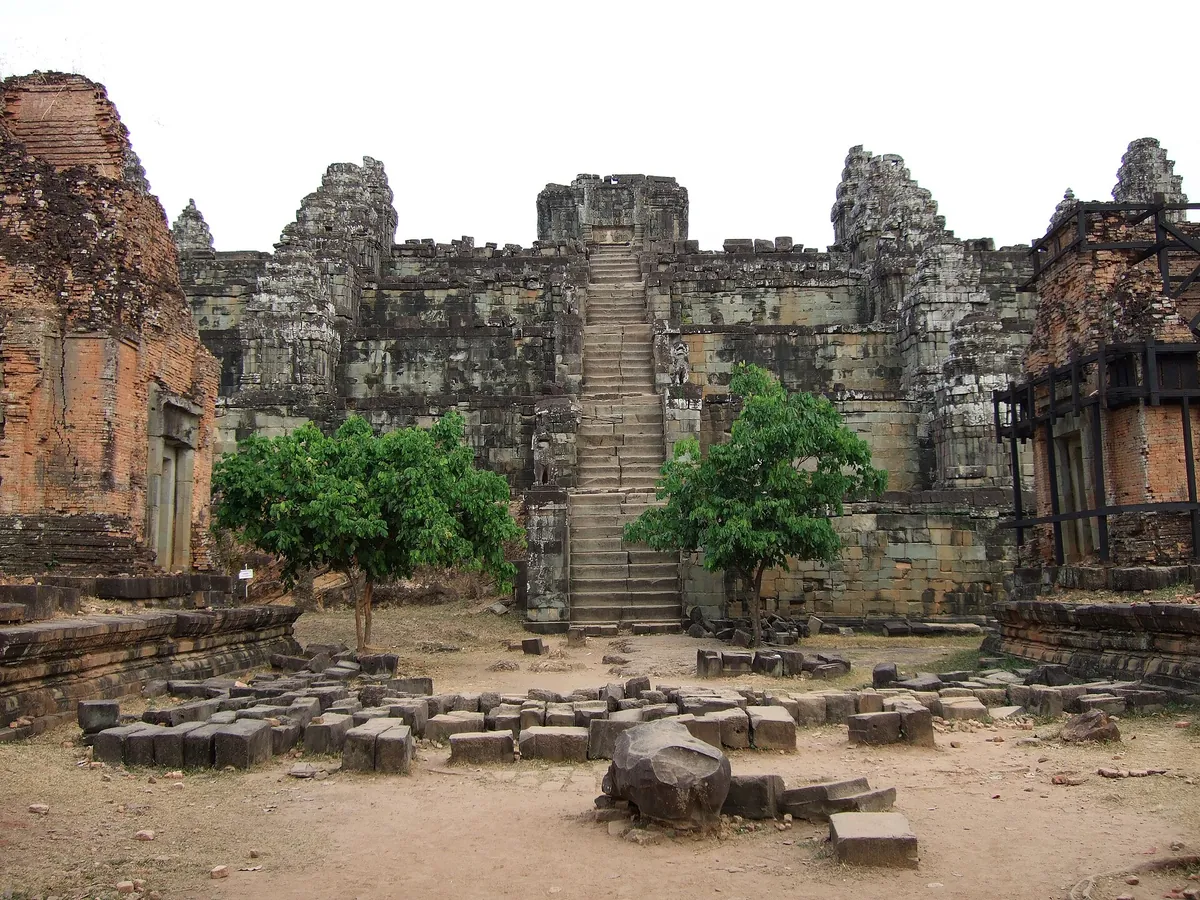 The stepped sandstone tiers and steep stair of Phnom Bakheng, the sunset hill on two-day Angkor Wat tours