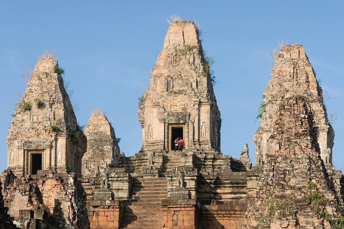 The brick and laterite towers of Pre Rup against a blue sky, a Grand Circuit temple on two-day Angkor Wat tours